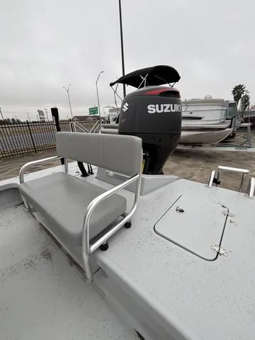 Slide: The Image of 2024 Majek M2 ILLUSION boat with Suzuki outboard motor, featuring a gray bench seat. - 6