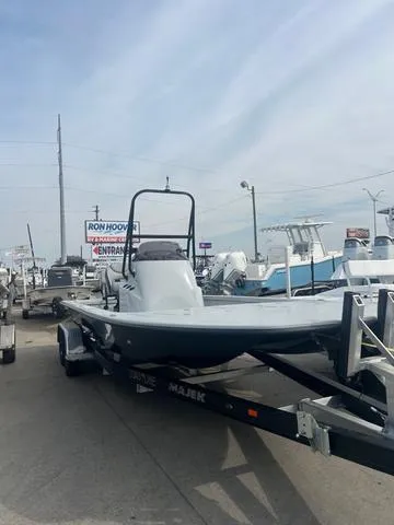 Slide: The Image of 2025 Majek 24 Reaper boat on trailer at dealership, ready for sale. - 1