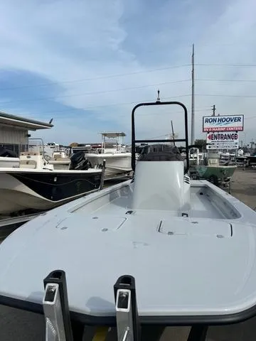 Slide: The Image of 2025 Majek 24 Reaper boat at Ron Hoover dealership, showcasing sleek design and spacious deck. - 3