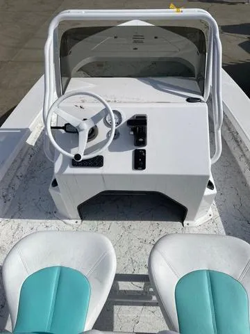 Slide: The Image of 2025 Majek 20 Xtreme boat interior with steering console and dual seats. - 5