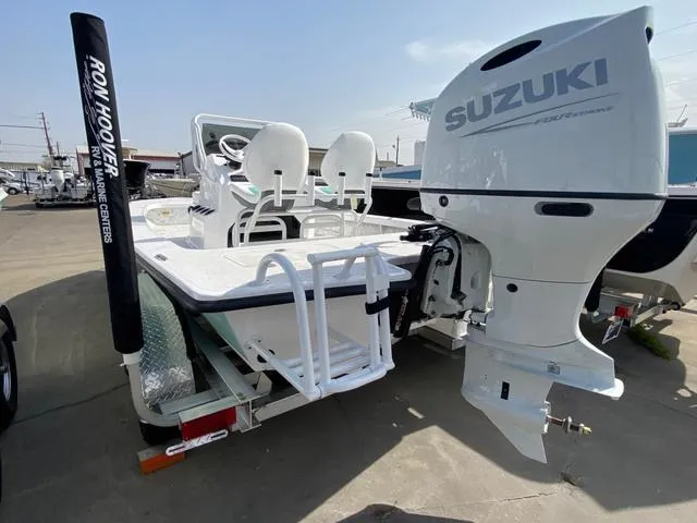 Slide: The Image of 2025 Majek 20 Xtreme boat with Suzuki outboard motor on trailer. - 7