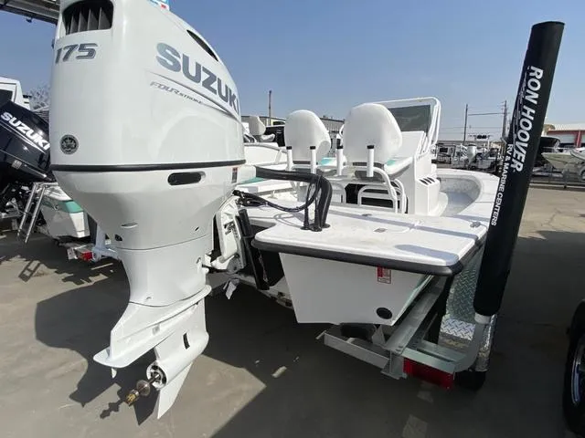 Slide: The Image of 2025 Majek 20 Xtreme boat with Suzuki 175 engine, displayed at Ron Hoover dealership. - 8