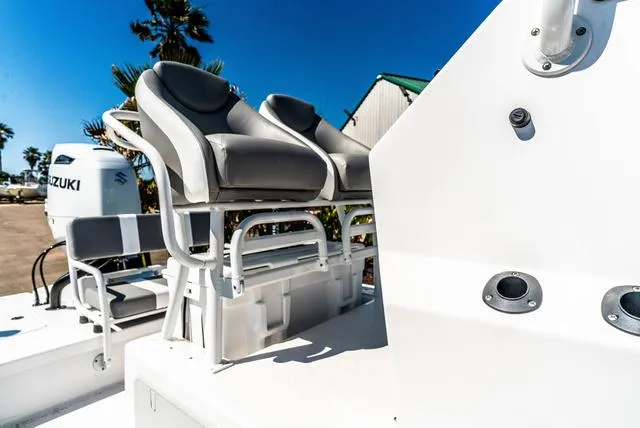 Slide: The Image of 2025 Majek M2 ILLUSION boat with dual seats and Suzuki engine, outdoor setting. - 13