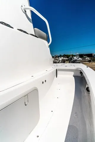 Slide: The Image of 2025 Majek M2 ILLUSION boat, sleek white design, clear blue sky background. - 15