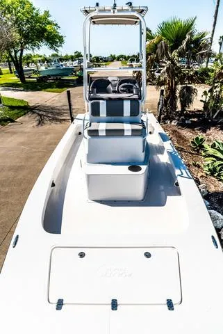 Slide: The Image of 2025 Majek M2 ILLUSION boat, sleek design, white exterior, outdoor setting. - 17