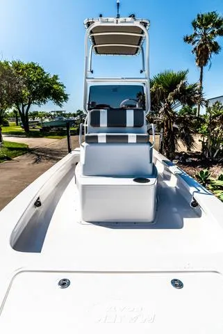 Slide: The Image of 2025 Majek M2 ILLUSION boat with sleek design, white seating, and sunny outdoor setting. - 18