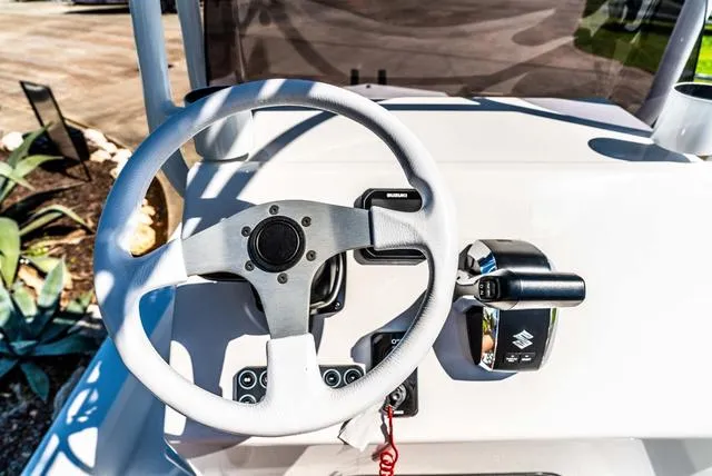 Slide: The Image of Steering console of 2025 Majek M2 ILLUSION boat with Suzuki controls. - 24