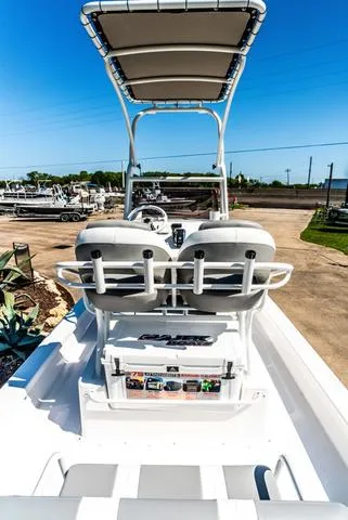 Slide: The Image of 2025 Majek M2 ILLUSION boat with dual seats and canopy in a sunny marina. - 5