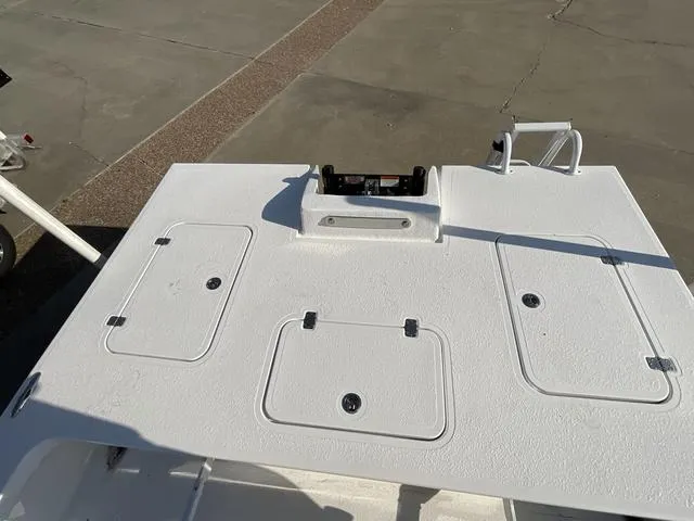 Slide: The Image of 2025 Majek 24 Reaper boat deck with storage compartments and clean design. - 15