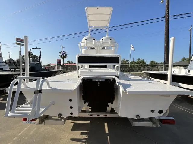 Slide: The Image of 2025 Majek 24 Reaper boat, rear view, on trailer, in outdoor setting. - 4