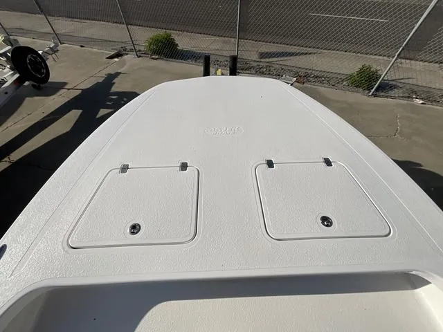Slide: The Image of 2025 Majek 24 Reaper boat deck with storage compartments, viewed from above. - 5