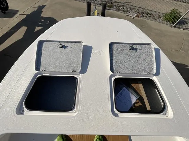 Slide: The Image of 2025 Majek 24 Reaper boat deck with open storage compartments. - 6