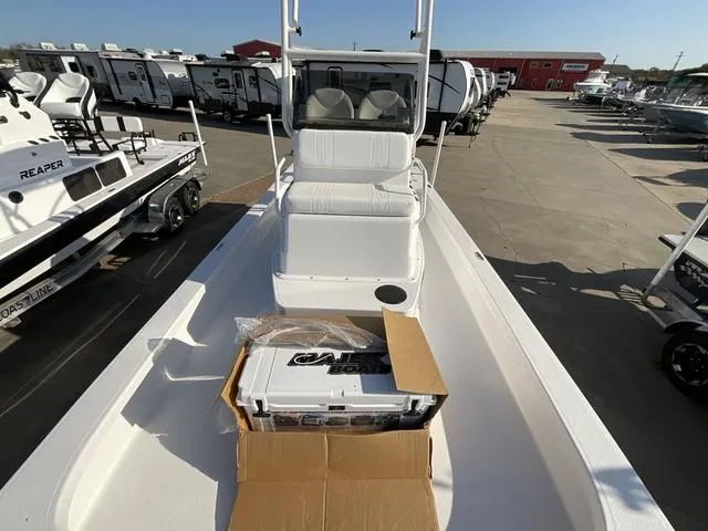 Slide: The Image of 2025 Majek 24 Reaper boat on display, featuring spacious deck and seating. - 7