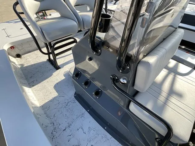 Slide: The Image of 2025 Majek 22 XTREME boat interior with seating and console details. - 13