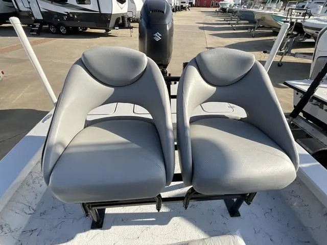 Slide: The Image of 2025 Majek 22 XTREME boat with dual gray seats and Suzuki outboard motor. - 15