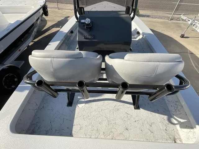 Slide: The Image of 2025 Majek 22 XTREME boat interior with dual seats and rod holders. - 16