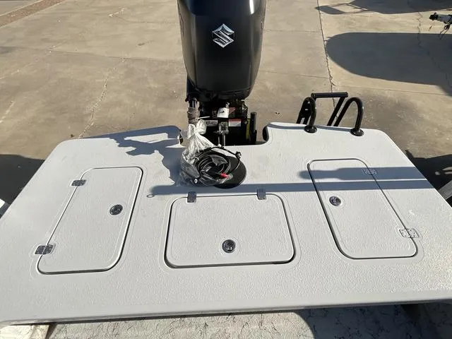 Slide: The Image of 2025 Majek 22 XTREME boat with Suzuki outboard motor, featuring a spacious rear deck. - 17