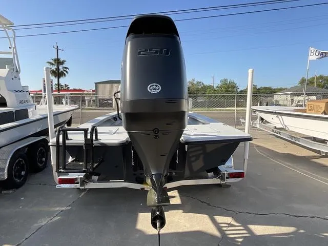 Slide: The Image of 2025 Majek 22 XTREME boat with powerful 250 engine, parked on a trailer. - 5