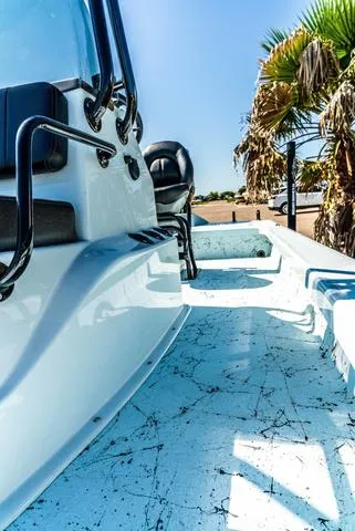 Slide: The Image of 2025 Majek 2206 Illusion boat with sleek design, palm trees in background. - 17