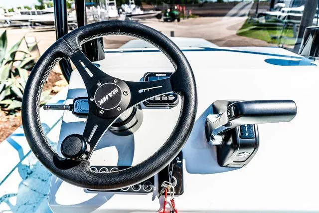 Slide: The Image of 2025 Majek 2206 Illusion boat dashboard with steering wheel and controls. - 19