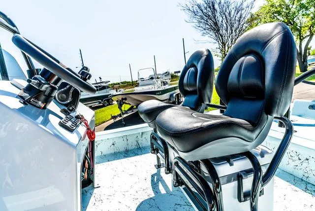 Slide: The Image of 2025 Majek 2206 Illusion boat interior with black leather seats and steering console. - 20