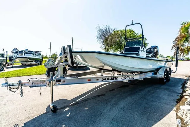 Slide: The Image of 2025 Majek 2206 Illusion boat on trailer, parked outdoors, sunny day. - 4