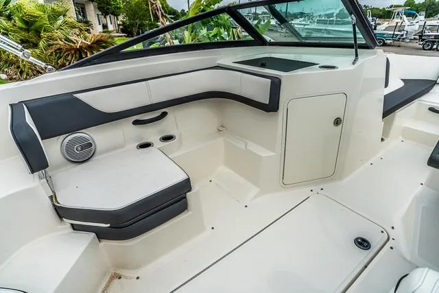 Slide: The Image of 2015 Sea Ray 19spx ob boat interior with seating and storage compartments. - 11