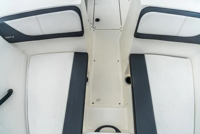 Slide: The Image of 2015 Sea Ray 19spx ob boat interior with white and black seating. - 17