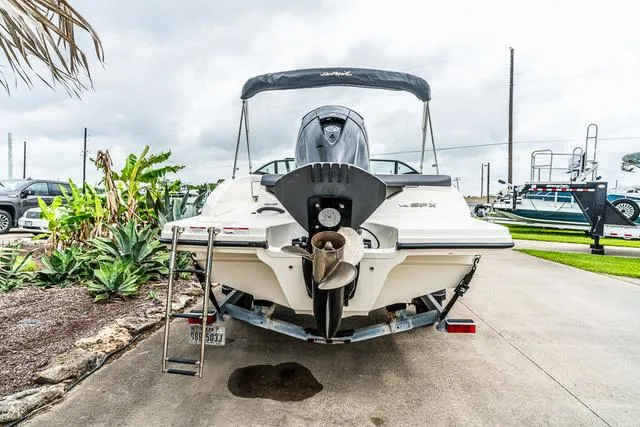 Slide: The Image of 2015 Sea Ray 19spx ob boat, rear view with outboard motor and trailer. - 4