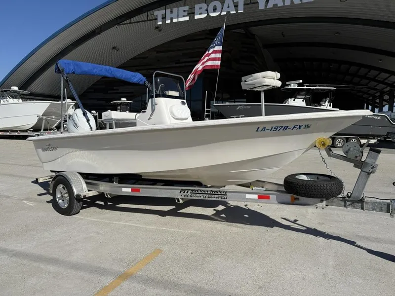 Slide: The Image of 2011 NauticStar 190R RG boat on trailer at The Boat Yard, with American flag. - 7