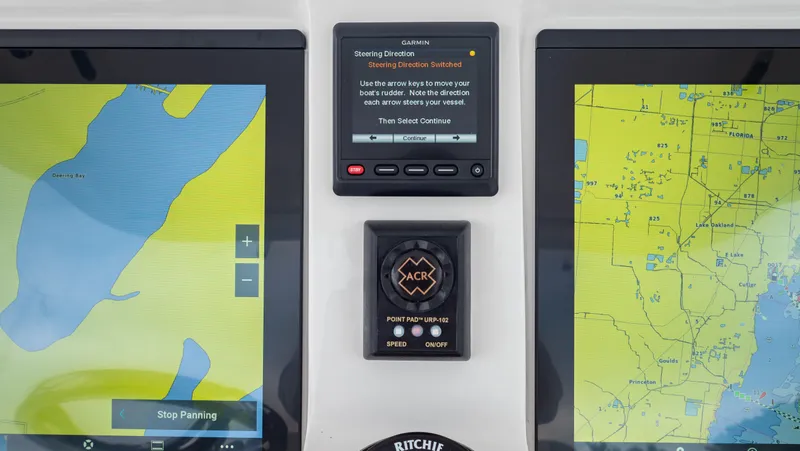 Slide: The Image of Navigation system of 2022 Intrepid 409 Valor boat with dual screens and control panel. - 12