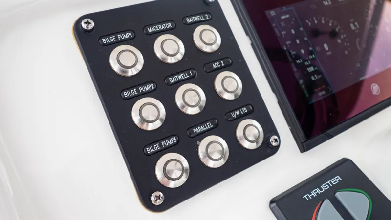Slide: The Image of Control panel of a 2022 Intrepid 409 Valor boat with labeled buttons and display. - 16