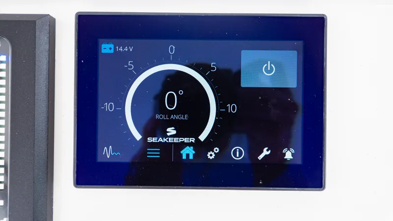 Slide: The Image of Seakeeper control display on 2022 Intrepid 409 Valor, showing roll angle and power status. - 21