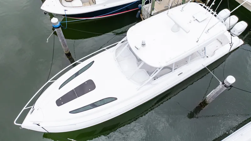 Slide: The Image of 2022 Intrepid 409 Valor boat docked in marina, aerial view. - 25