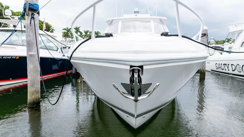 Slide: The Image of 2022 Intrepid 409 Valor boat docked in marina, front view. - 28