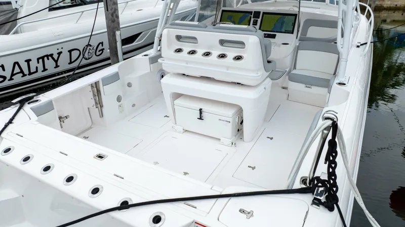 Slide: The Image of 2022 Intrepid 409 Valor boat interior with seating and control panel. - 31