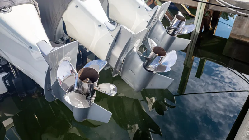 Slide: The Image of Propellers of a 2022 Intrepid 409 Valor boat reflecting in water. - 32