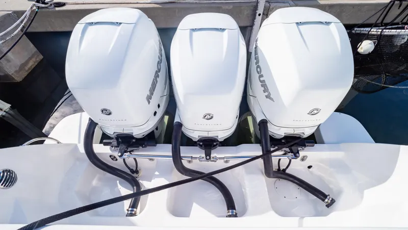 Slide: The Image of Triple Mercury outboard engines on a 2022 Intrepid 409 Valor boat. - 35