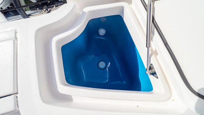 Slide: The Image of Livewell on 2022 Intrepid 409 Valor boat, featuring a blue interior. - 39