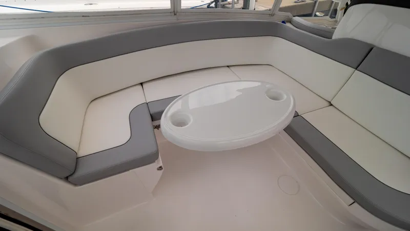 Slide: The Image of Luxurious seating area on 2022 Intrepid 409 Valor boat with a small table. - 4