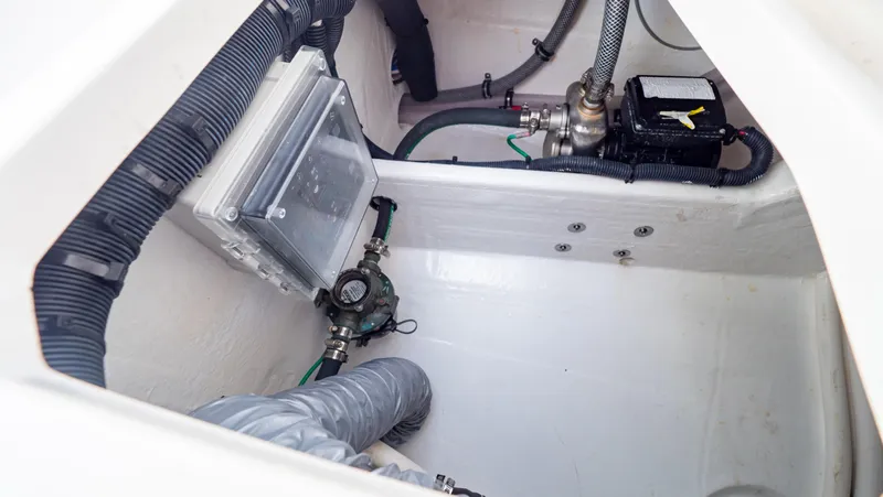 Slide: The Image of 2022 Intrepid 409 Valor boat interior showing mechanical components and wiring. - 44