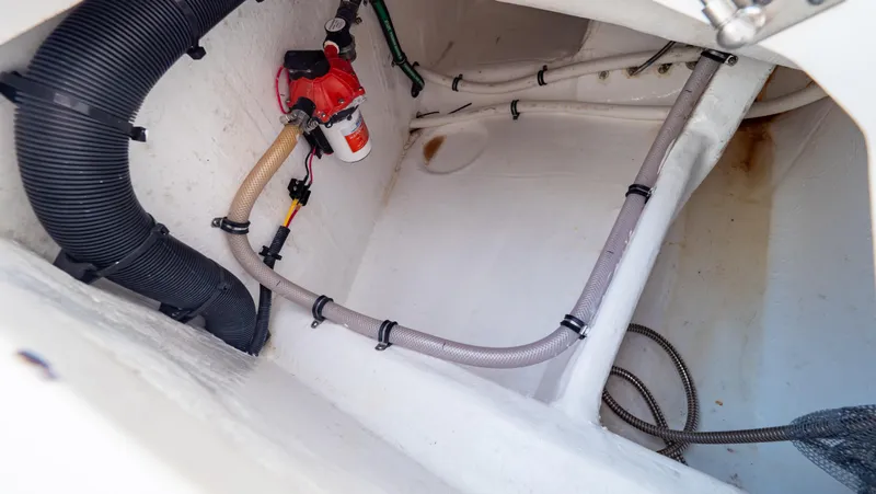 Slide: The Image of 2022 Intrepid 409 Valor interior with visible hoses and wiring. - 45