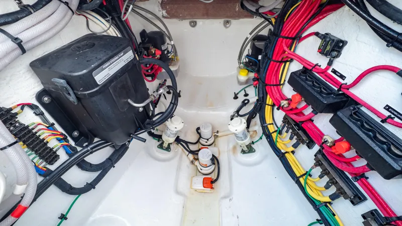 Slide: The Image of Electrical wiring and components inside a 2022 Intrepid 409 Valor boat. - 47