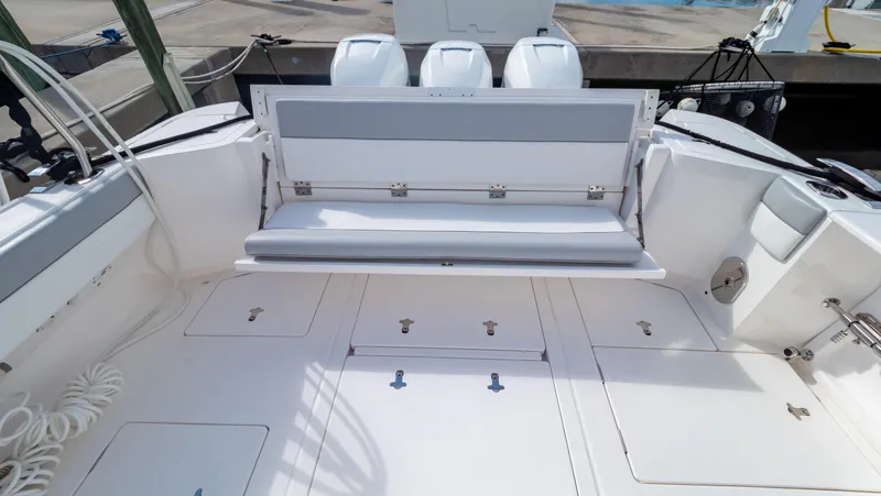 Slide: The Image of 2022 Intrepid 409 Valor boat deck with seating and storage compartments. - 5