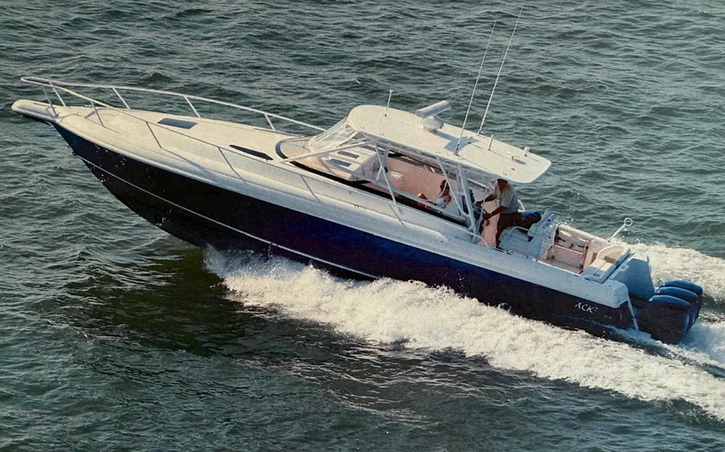 Slide: The Image of 2005 Intrepid 377 Walkaround boat cruising on open water. - 1