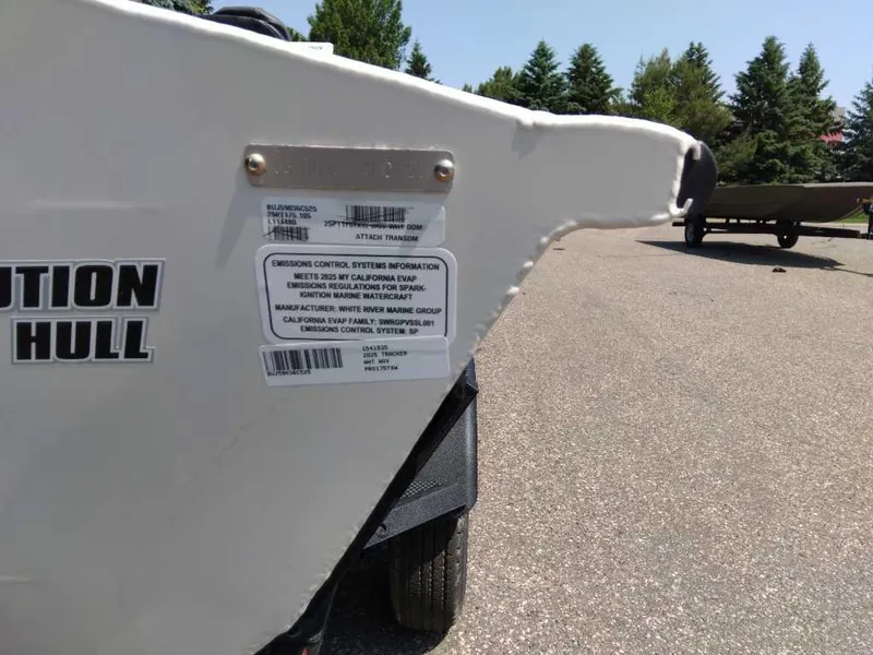 Slide: The Image of 2025 Tracker Pro Team 175 boat with emission control labels on the hull. - 23