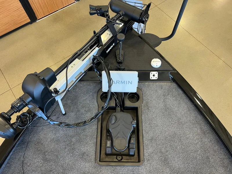 Slide: The Image of 2025 Tracker Savage 215 boat with Garmin navigation system and trolling motor. - 4