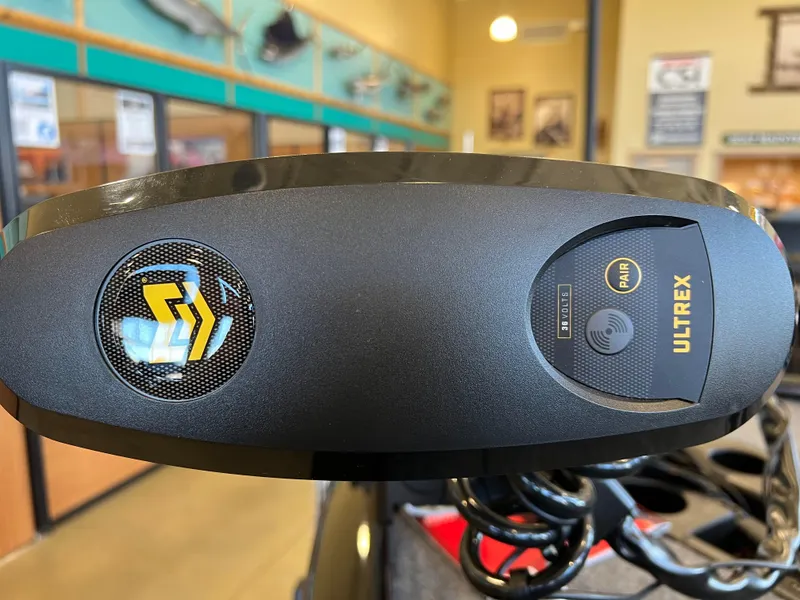 Slide: The Image of 2025 Tracker Savage 215 boat with Ultrex motor control panel in showroom. - 5