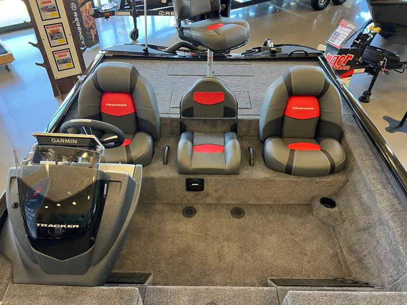 Slide: The Image of 2025 Tracker Savage 215 boat interior with Garmin system and three seats. - 6