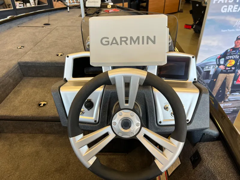 Slide: The Image of Steering wheel of 2025 Tracker Savage 215 boat with Garmin navigation system. - 7